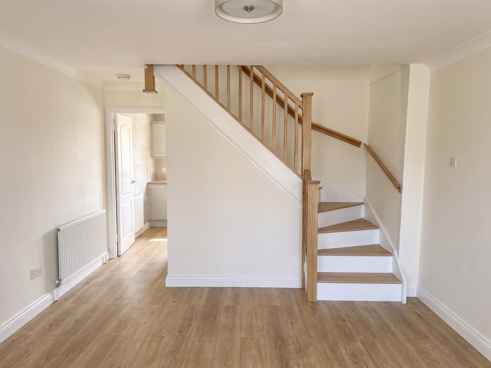After renovation view of the staircase and living area